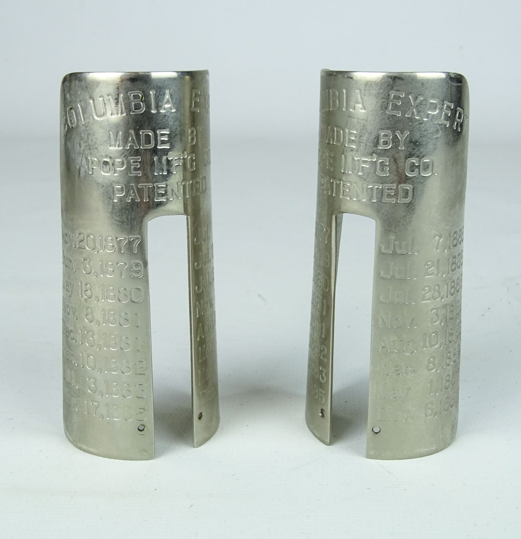 Dust Shields: Lot (2) Columbia Expert dust shields. Good condition. Collection of Margaret Ann Baker.