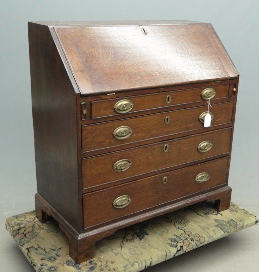 19th c. English Slant Lid Desk: 19th c. English oak four graduated drawers slant lid desk with bracket base. Backboard replaced. 38" W 19 1/2" D 41 1/2" Ht.