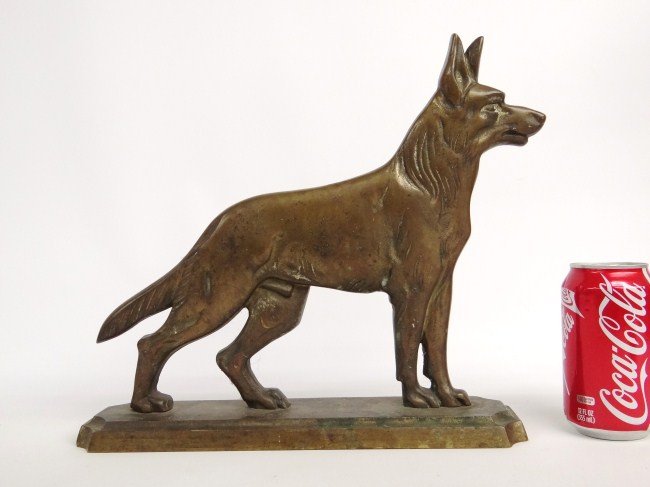 Doorstop: Brass dog doorstop, early 20th c. stamped "Miller Brass Foundry Three Rivers, Que". 13" W 12" Ht.
