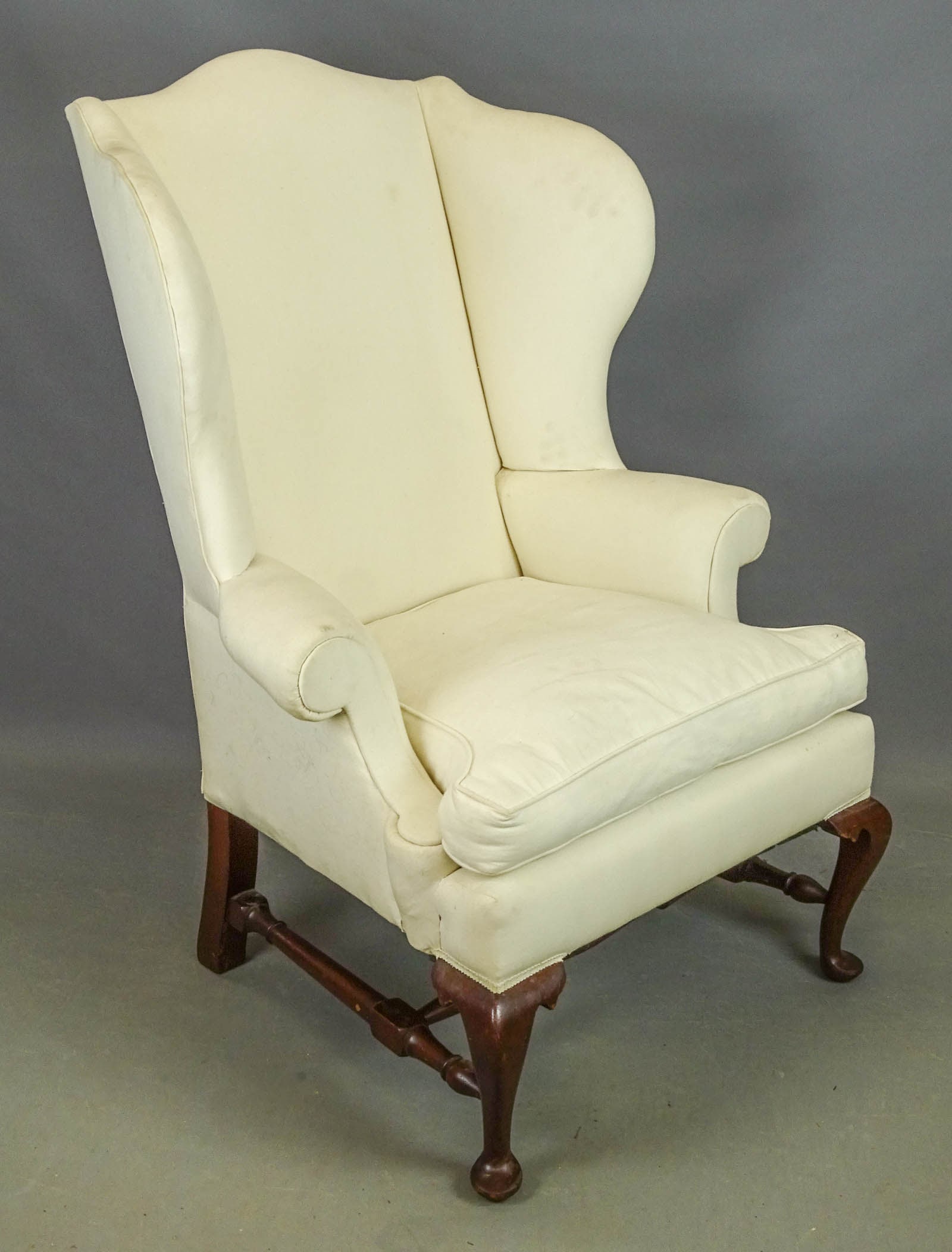 Chippendale Style Wing Chair: North Shore mahogany carved upholstered wing chair. 21" seat Ht., 48" overall Ht..