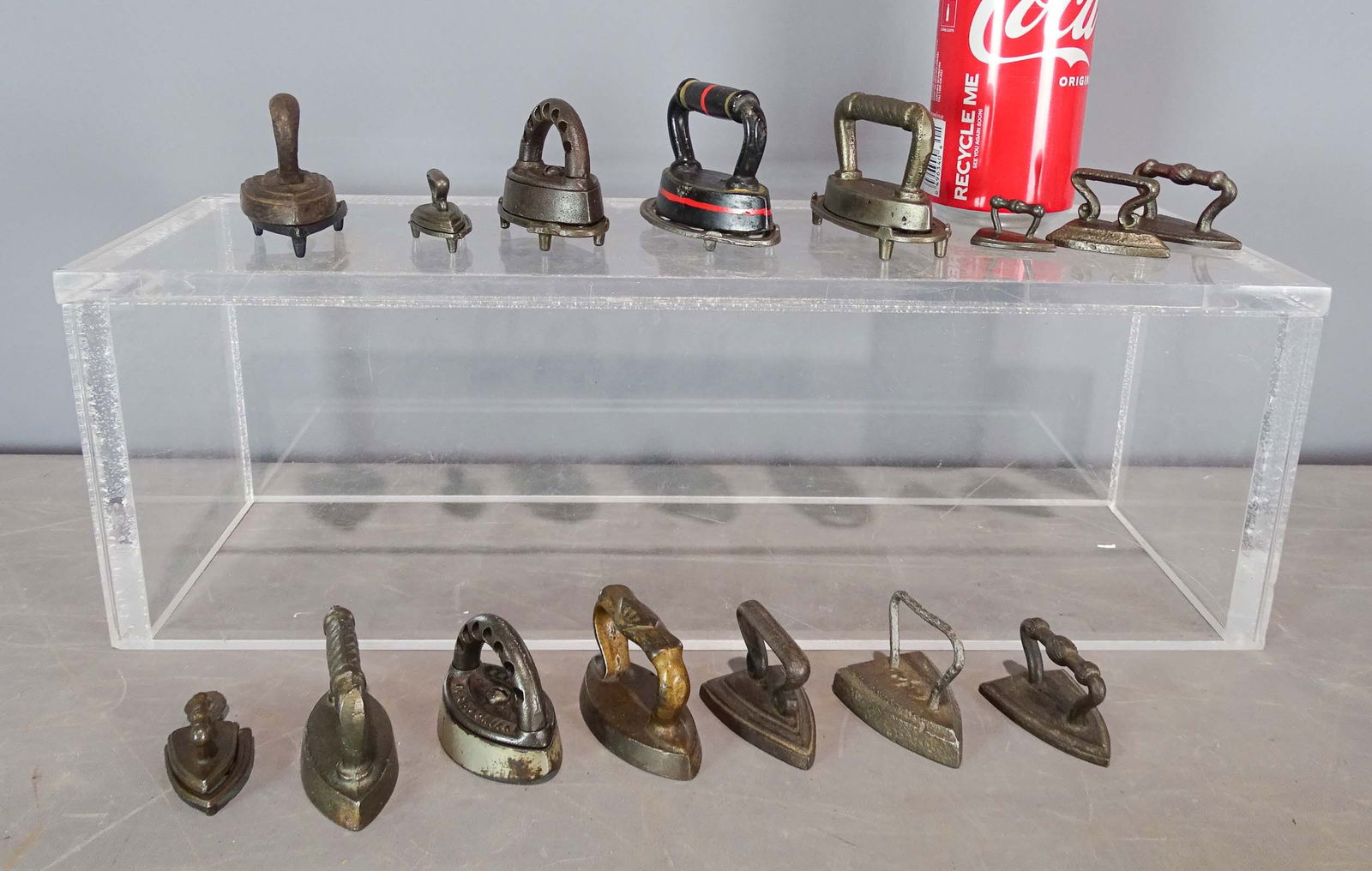 Miniature Irons: Lot (14) early miniature irons. Some with trivets.