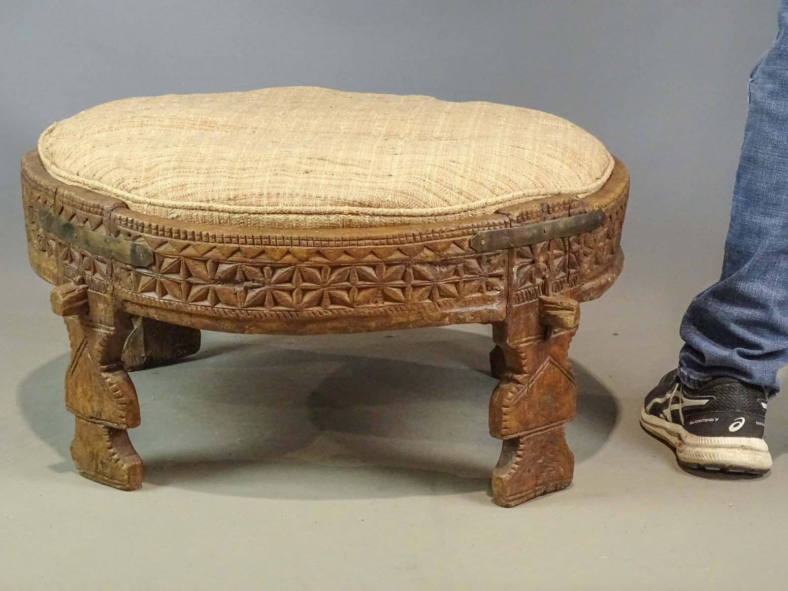 Carved Stool: Indian hardwood carved stool (ottoman). 27" D., 13" Ht..