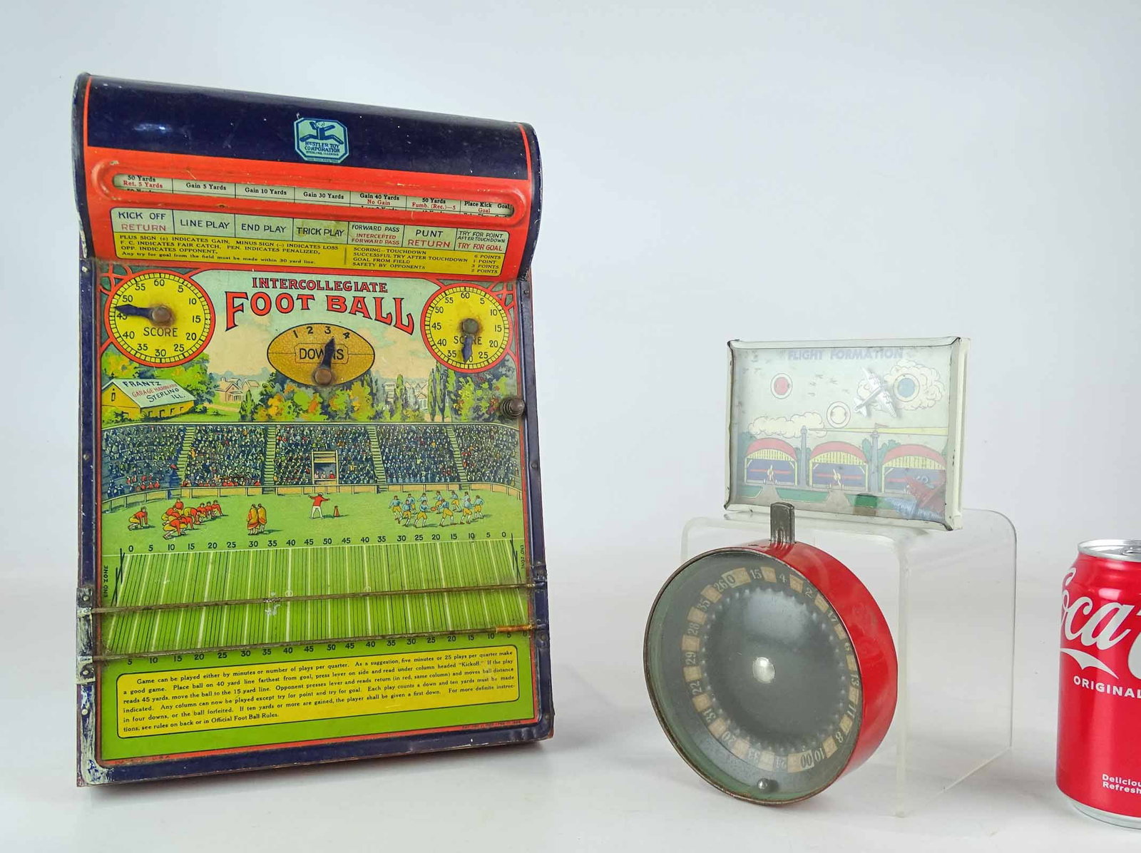 Toy Lot: Lot (3) toys including Roulette wheel (5" L.), "FLIGHT FORMATION" game (5" L.), Hustler Toy Corporation Intercollegiate Football game (13 1/2" L.).