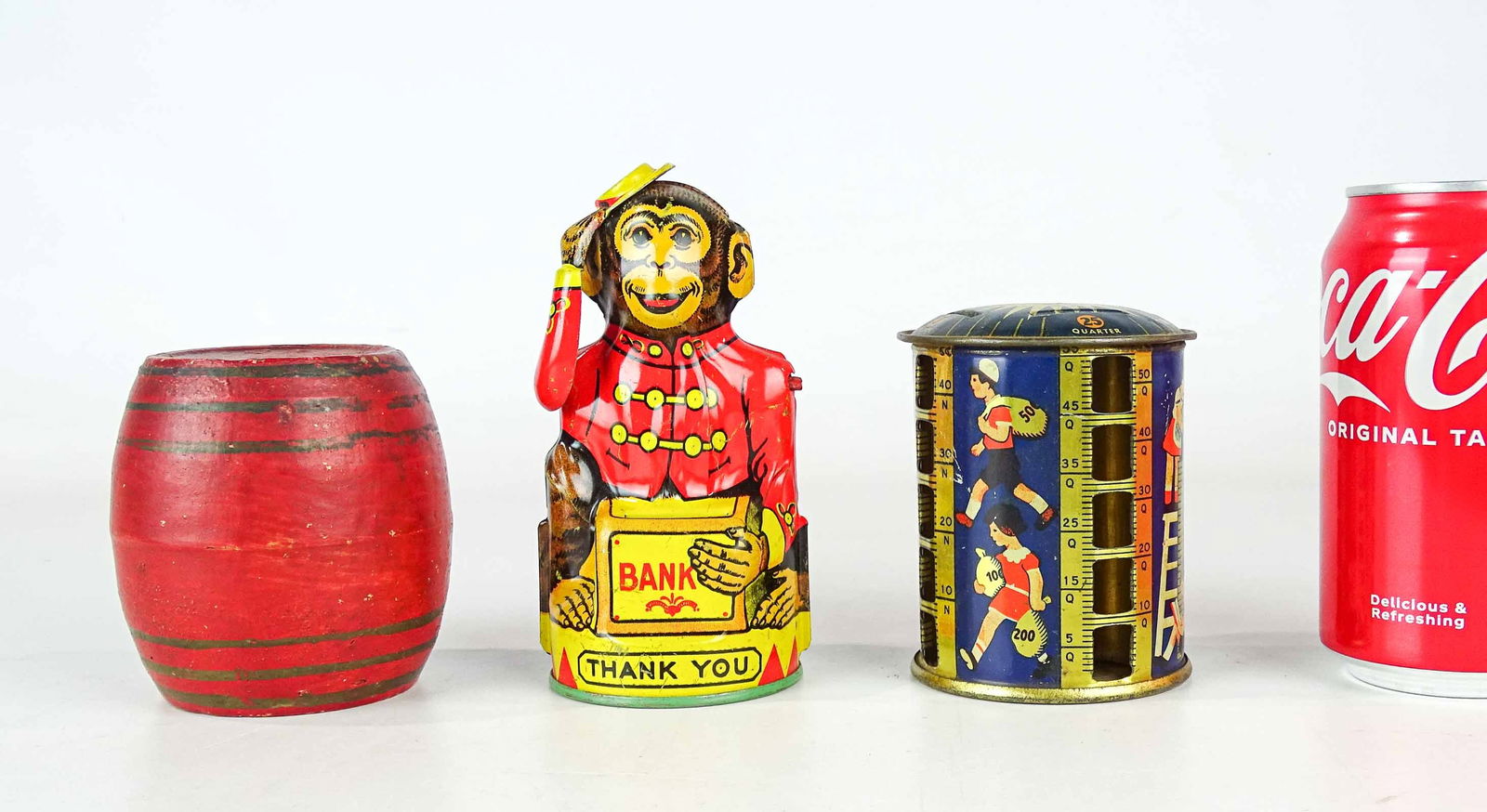 Bank Lot: Lot (3) banks including monkey (5 1/2" Ht.), pottery barrel (3 1/2" Ht.), coin bank (3 3/4" Ht.).