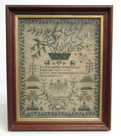 19th c. Sampler: 19th c. sampler featuring large basket of flowers, animals, urns with flowers, verse and name "Ann Gifford Finifhed this Work January 4 1828". Sight 13" x 16 1/2". Imperfections.