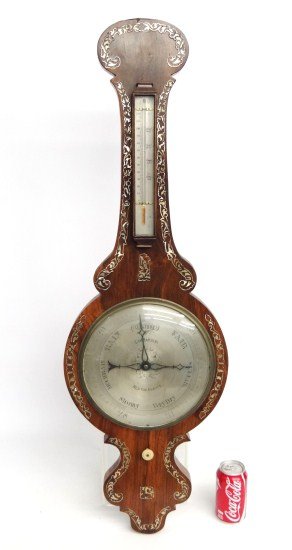 19th c. Barometer: 19th c. inlaid barometer marked "Lombardini Newton Abbott". 40" Ht.