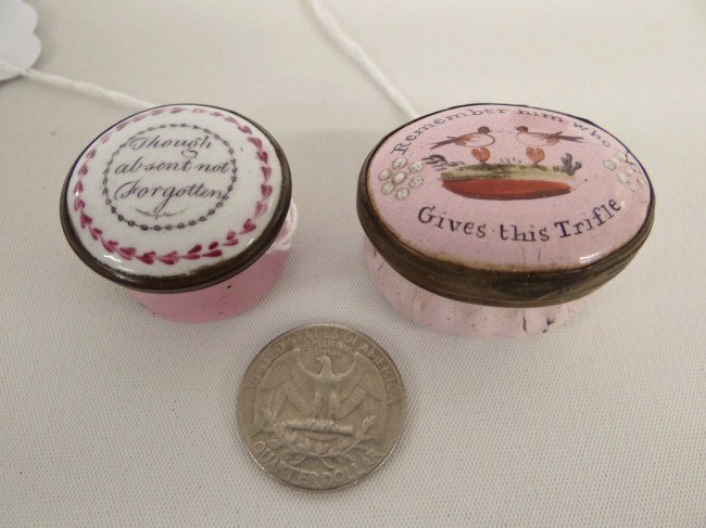 19th c. Pill Boxes: Lot two early 19th c. enamel pill boxes including "Though absent not forgotten" (1" Diameter) and "Remember him who Gives this Trifle" (1 1/2" Length).