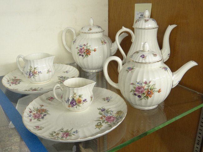 Royal Worcester Tea Set: Royal Worcester Roanoke tea set. Includes three teapots, cream, sugar and two plates (one has line).