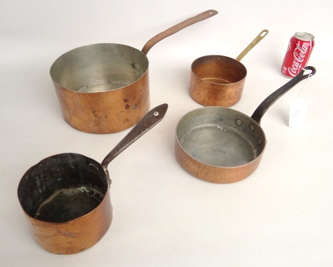 Copper Lot: Lot four French copper pots. 11" to 18 1/2" Length.