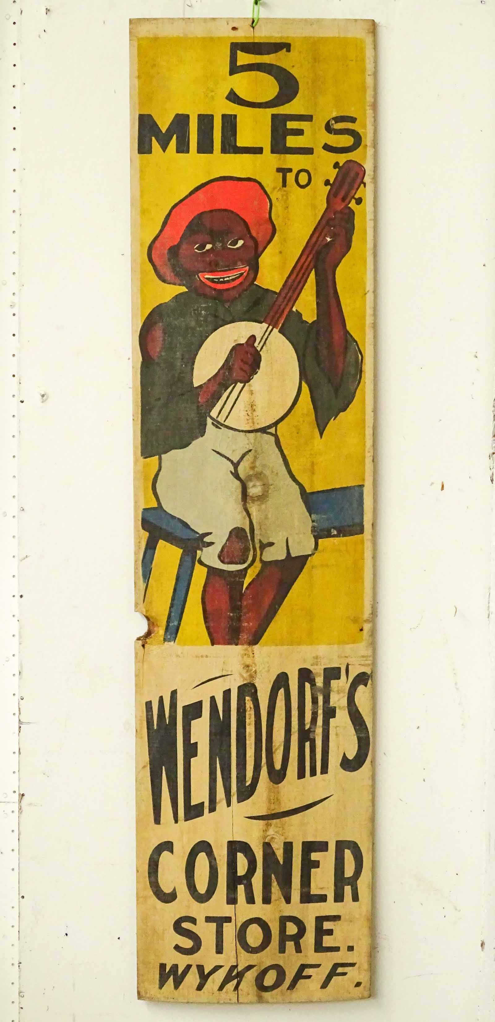 Trade Sign: Early Ithaca Sign works painted wooden sign "5 MILES TO WENDORF'S CORNET STORE WYKOFF". 11 1/2" x 47 1/2".