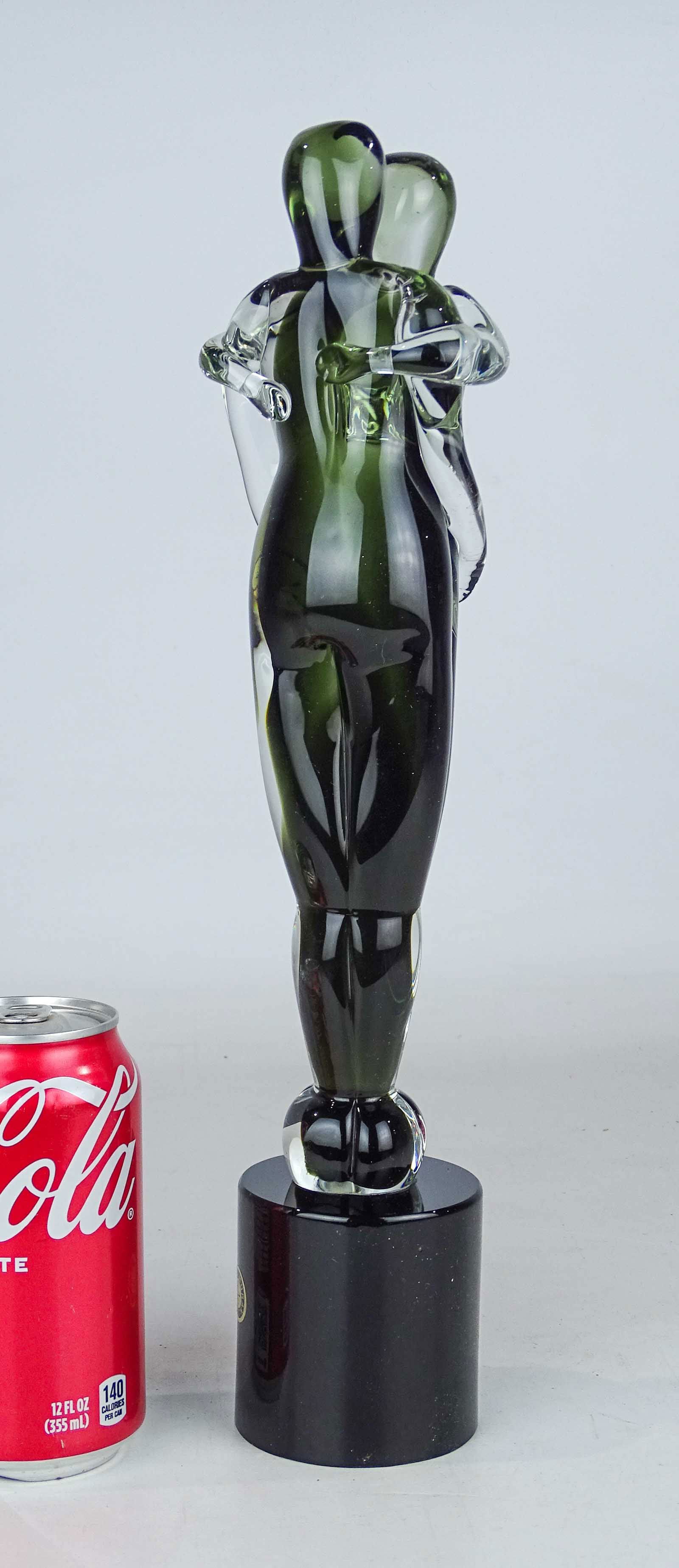 Mario Badioli Ogetti Glass: Mario Badioli Oggetti art glass ebracing couple. Signed under base and foil Murano label. 14" Ht..