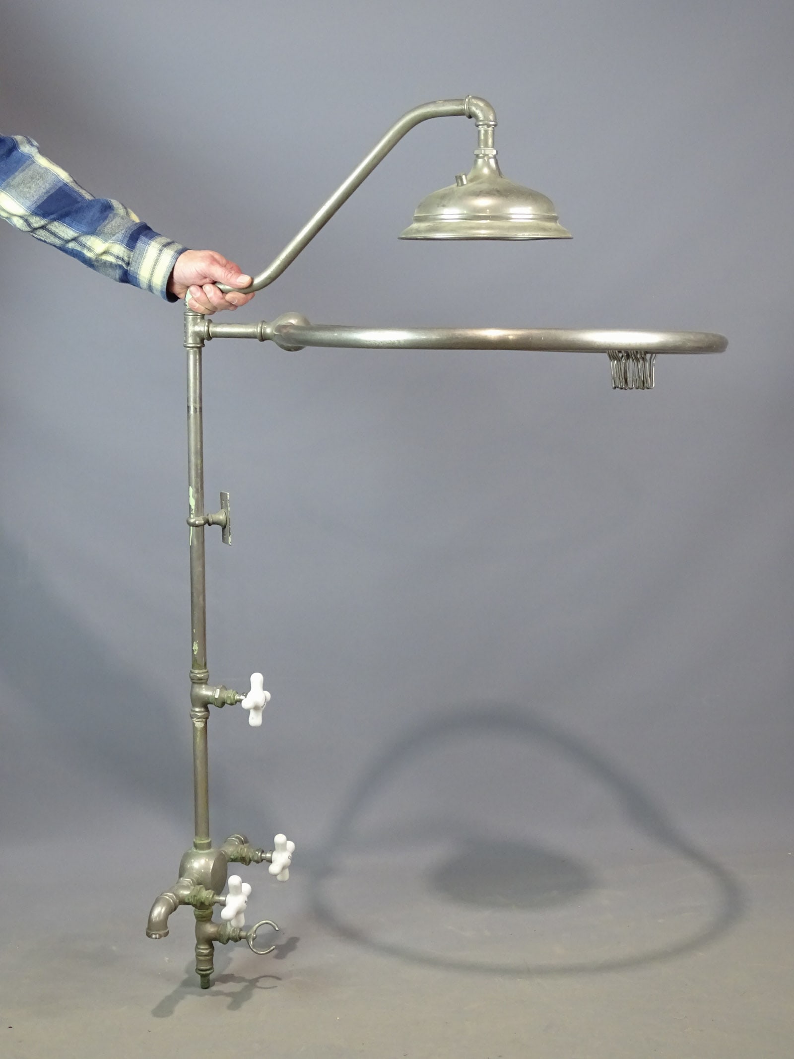 Early Shower Fitting: Early shower fitting with porcelain knobs. 48" Ht..