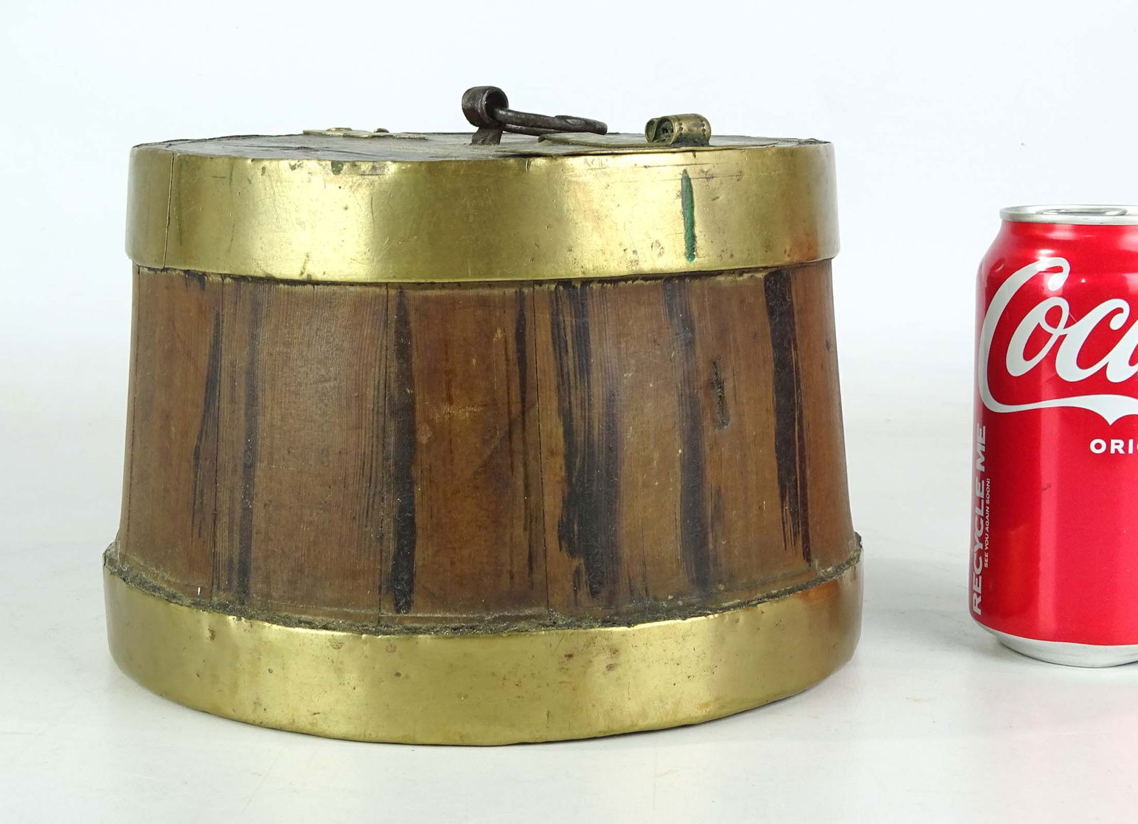 19th c. Asian Storage Barrel: 19thc . Asian storage barrel with brass bands and brass decoration at opening. Iron carrying ring. 8" D., 5" Ht..