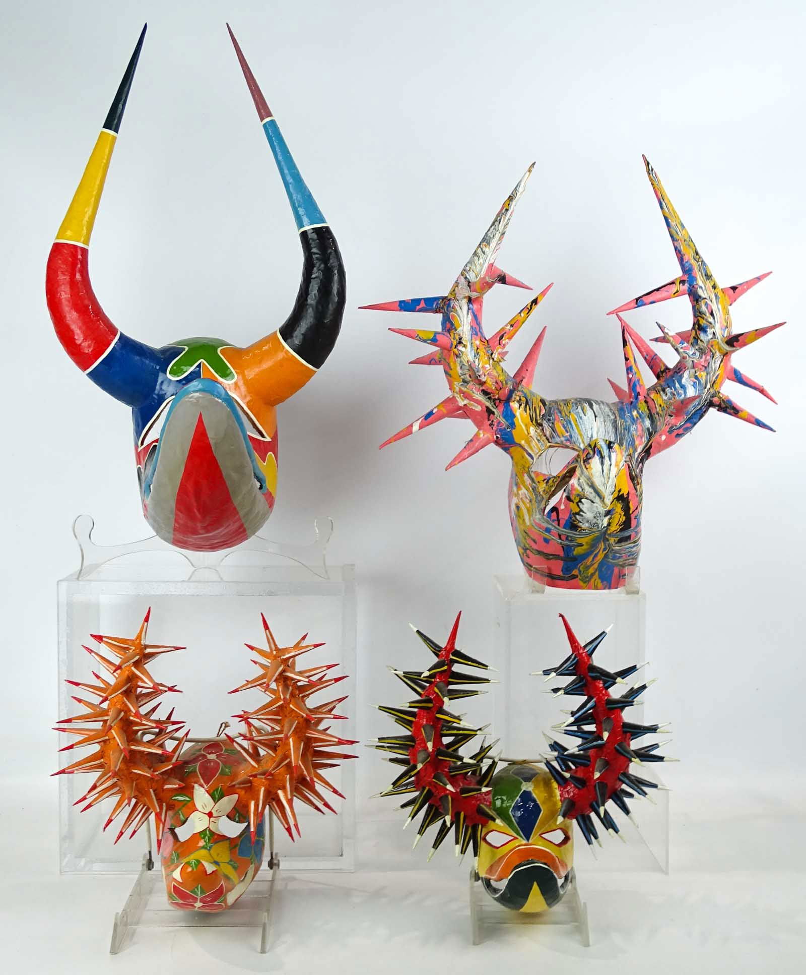 Artist Made Masks: (4) papier mache artist made masks. Largest 16" x 16".