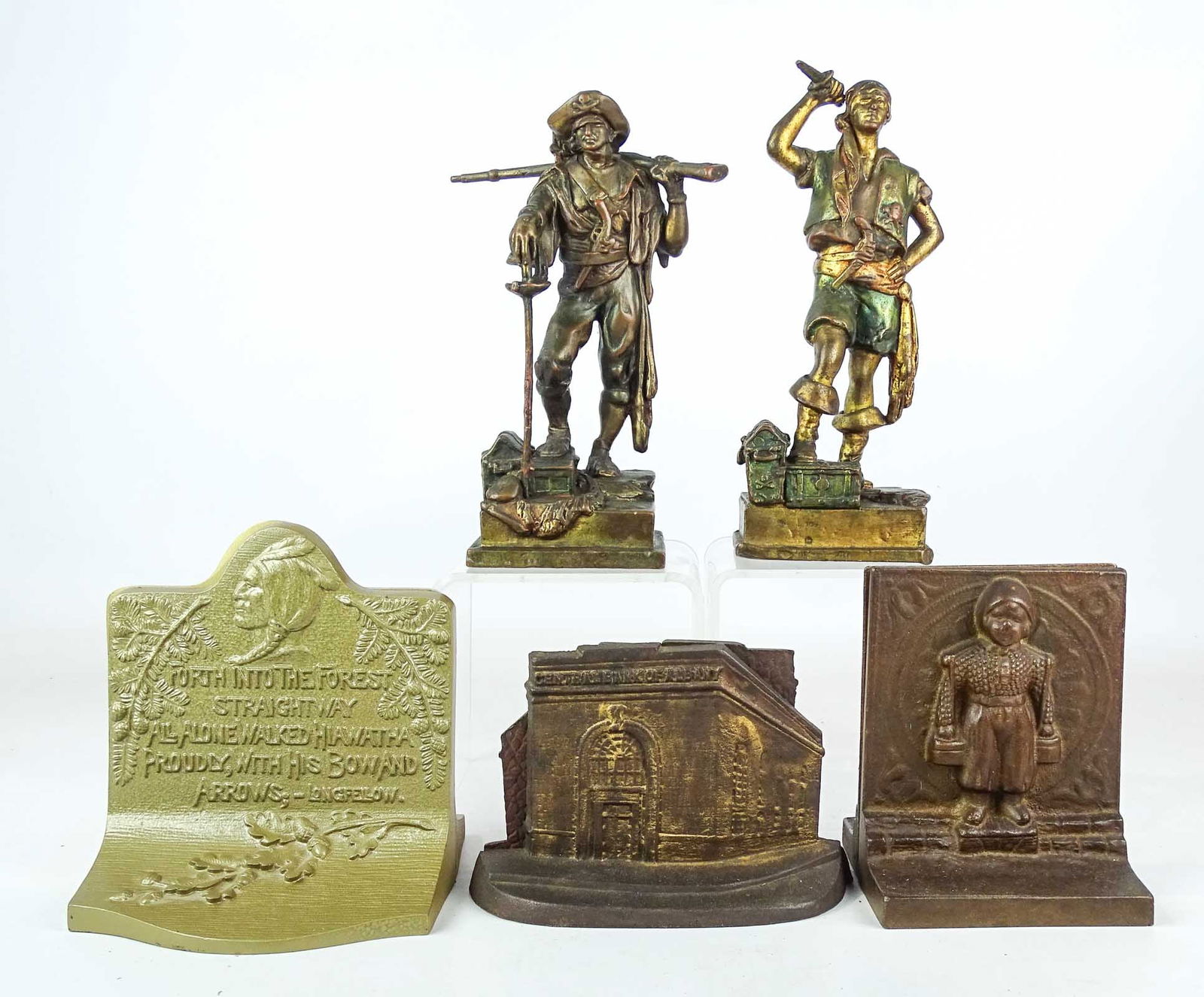 Bookends Lot: Bookends lot including: Pirates (9 1/4" Ht., gun damaged on one), cast iron Hiawatha (6 1/4" Ht.), cast iron Central Bank of Albany (4 1/4" Ht.), pair cast iron Dutch Boys (6" Ht.).