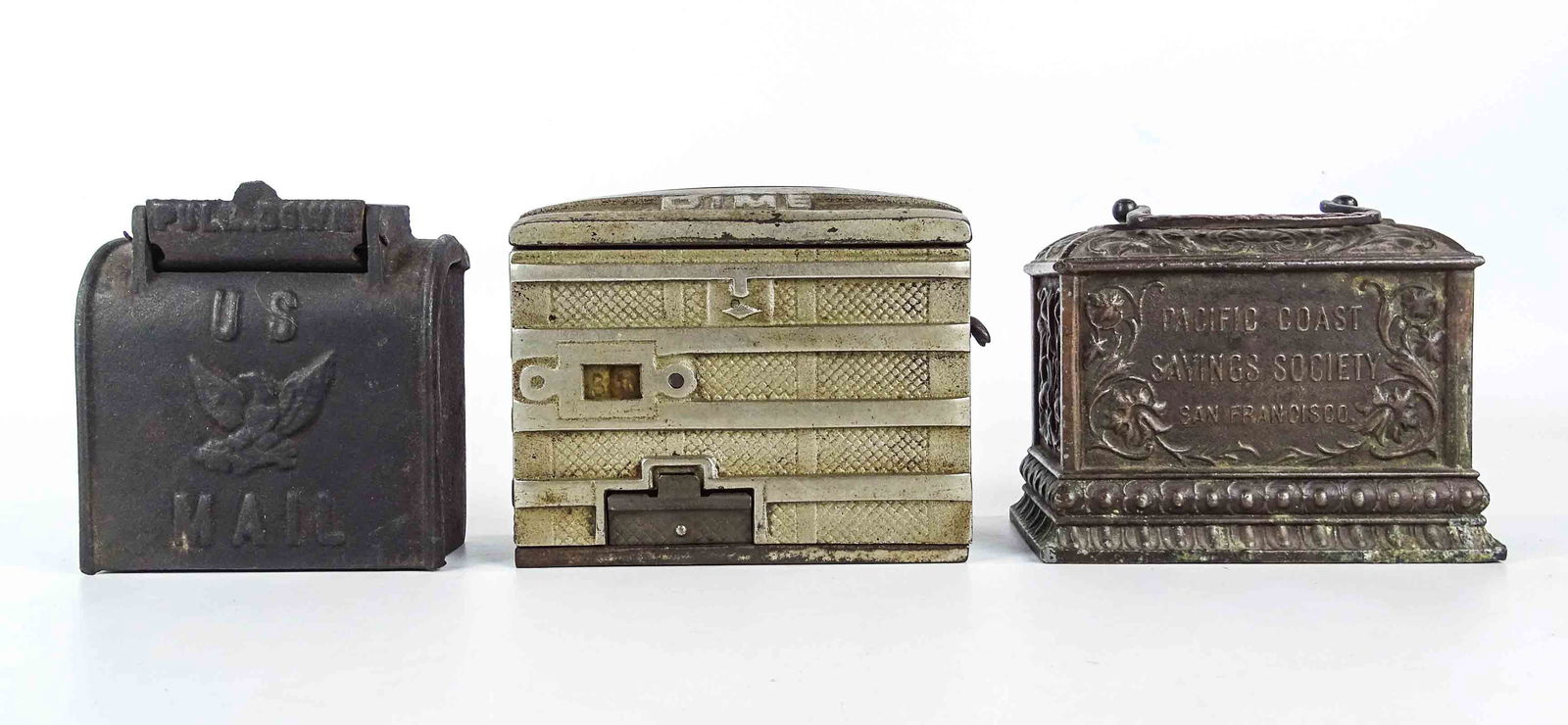 Bank Lot: Lot (3) cast iron banks including: Pacific Coast Saving Society (4" Ht., missing trap), U.S. Mail with eagle (4" Ht., Hubley, #855 Penny Bank Book), The Piaget Registering Bank (4 1/4" Ht., Mfg. Piage