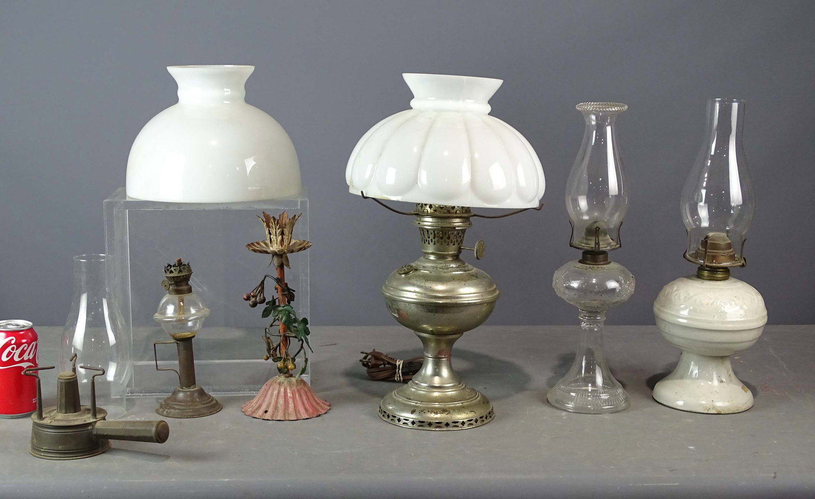 Lighting Lot: Lot of early oil lamps, chimneys, shades. Provenance: Clayton Store, Sue Connell, Southfield, Massachusetts
