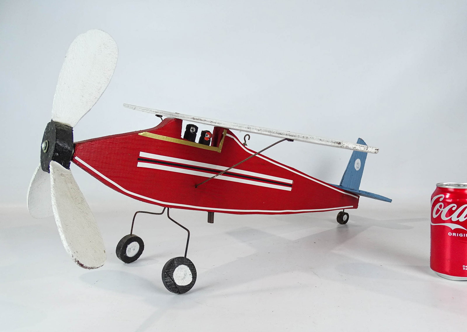 Folk Art Airplane: Folk art wooden painted airplane. 26" L., 20 1/2" wing span.