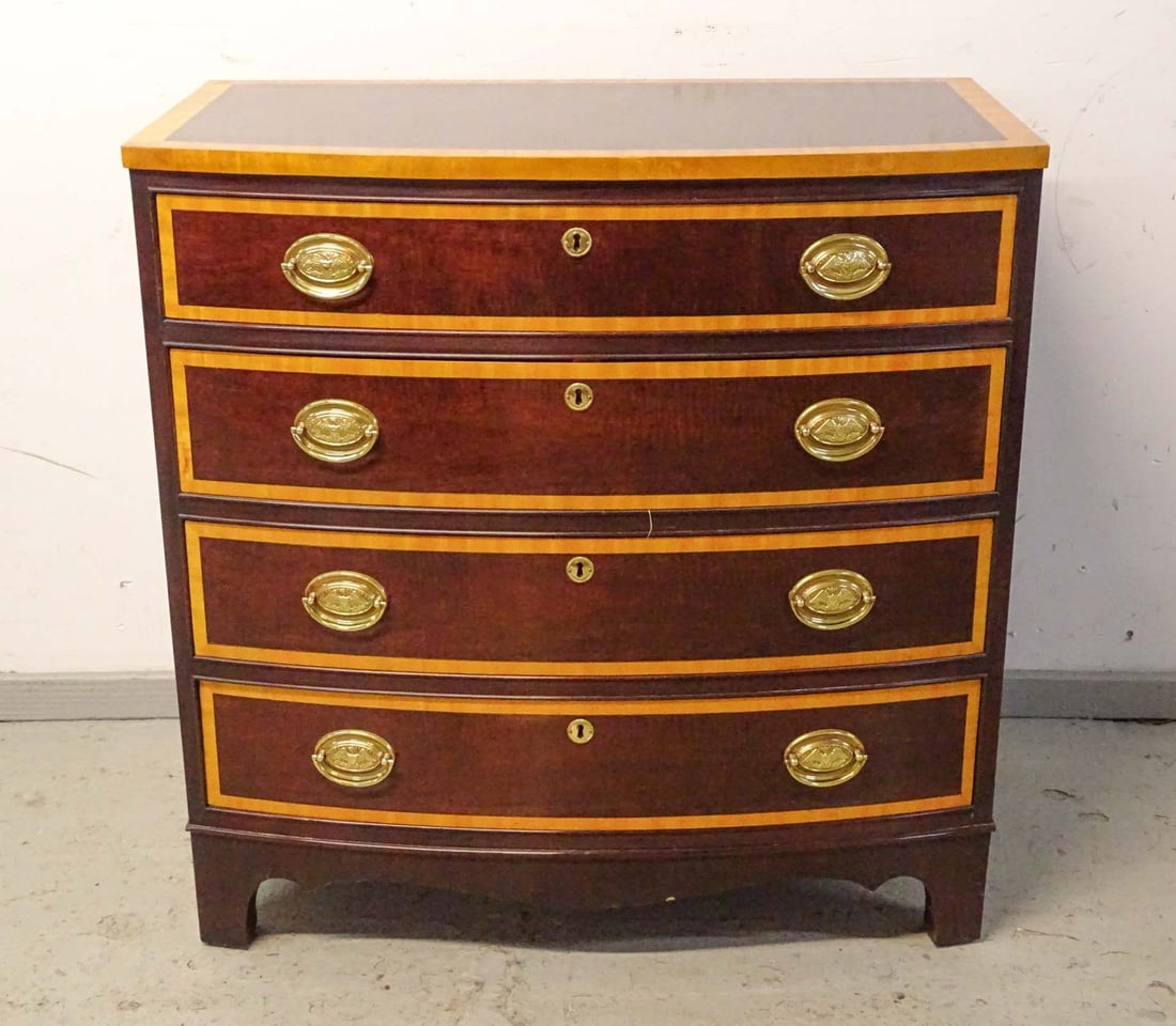 Stickley by Audi Chest of Drawers: Stickley by Audi bowfront chest of drawers. Some damage to one foot.