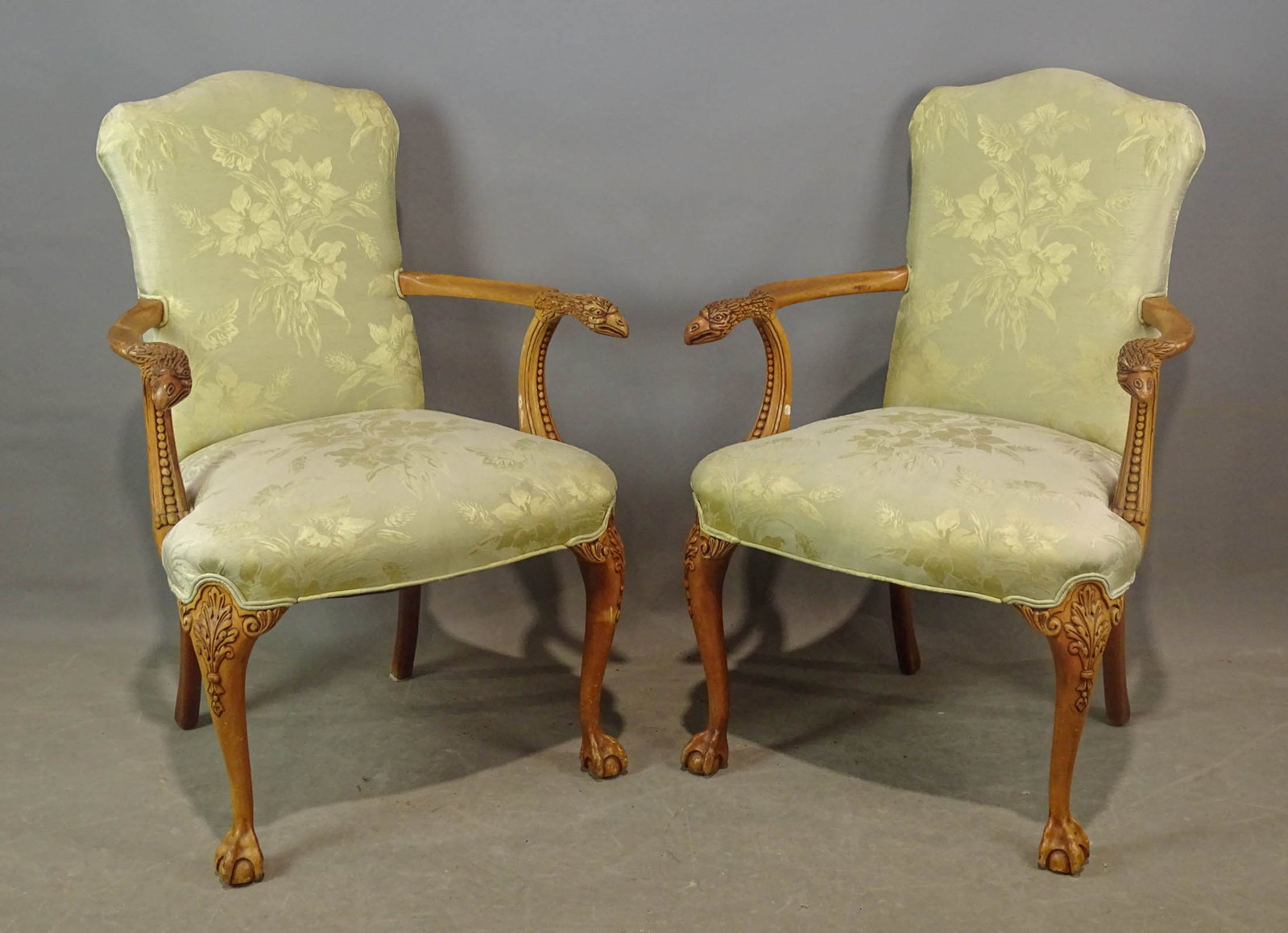 Pair of Eagle Head Carved Chairs: Pair of upholstered eagle head carved armchairs. 20" seat Ht., 35 1/2" overall Ht..
