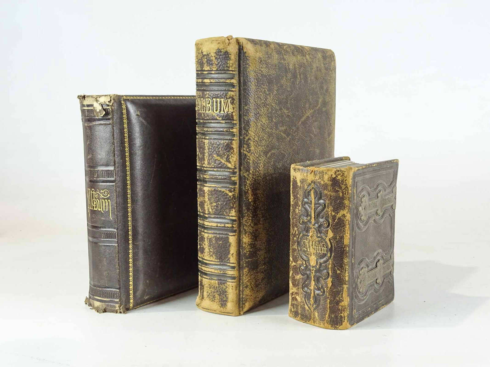 Early Photograph Albums: Three early photograph album. Mostly portrait cabinet cards. Largest album 12" x 8 1/2". Provenance: The Edward Herrmann Estate, Salisbury Connecticut.