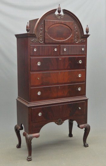 Mahogany Highboy: 1920's bonnet top mahogany highboy with carved feet. 38" W 19" W 81" Ht., retains label on back "Morris, Murch & Butler".
