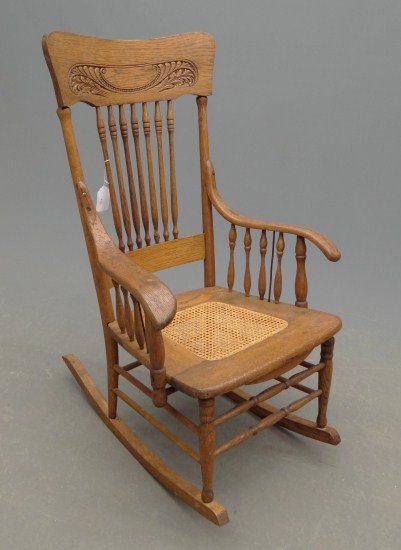 Victorian Oak Rocking Chair: Victorian oak rocking chair with cane seat. 16" Seat Ht. 40" Overall Ht.