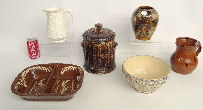 Pottery Lot: Lot six pieces early pottery including early redware vegetable bowl with slip decoration, art pottery vase, mottled bowl, Parian teapot, Rockingham glaze covered jar (provenance Wm. Doyle N.Y.C., redw
