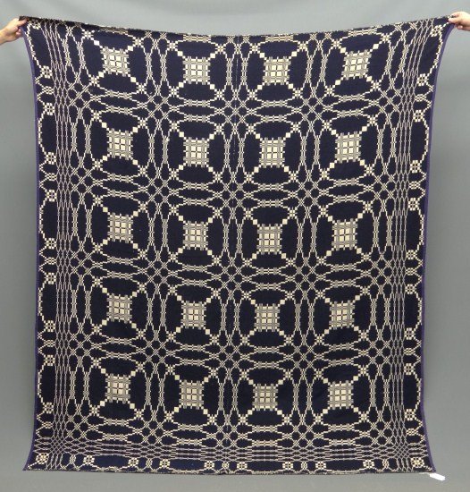 Coverlet: Jacquard blue and white coverlet. 76" x 86".