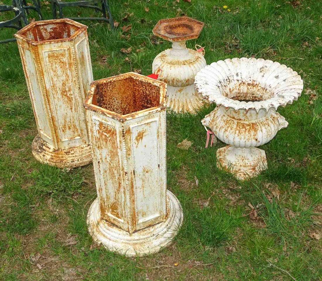 Wrought Iron Urns: Pair of wrought iron urns on hexagonal bases. 48" Ht. x 20" Dia.. Barbara Packer Collection.