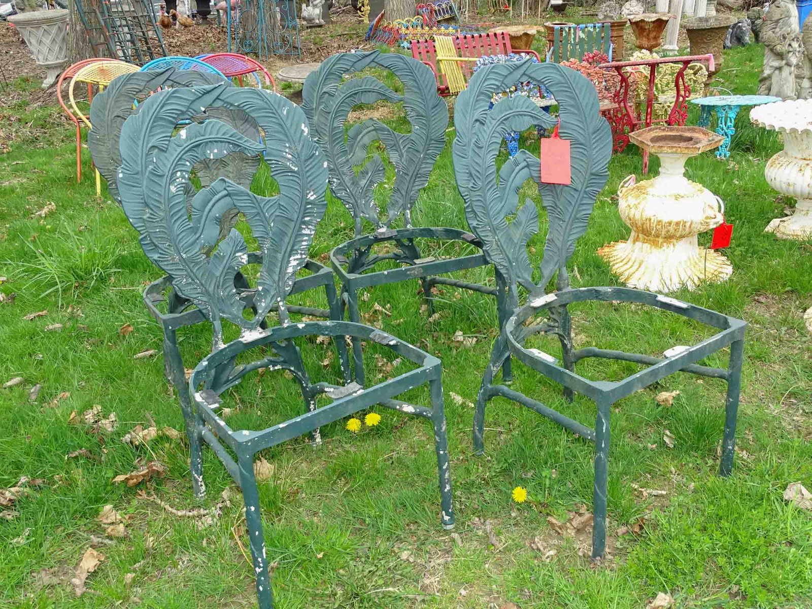 Chair Lot: Set of (4) metal leaf back chair without seats. Barbara Packer Collection.