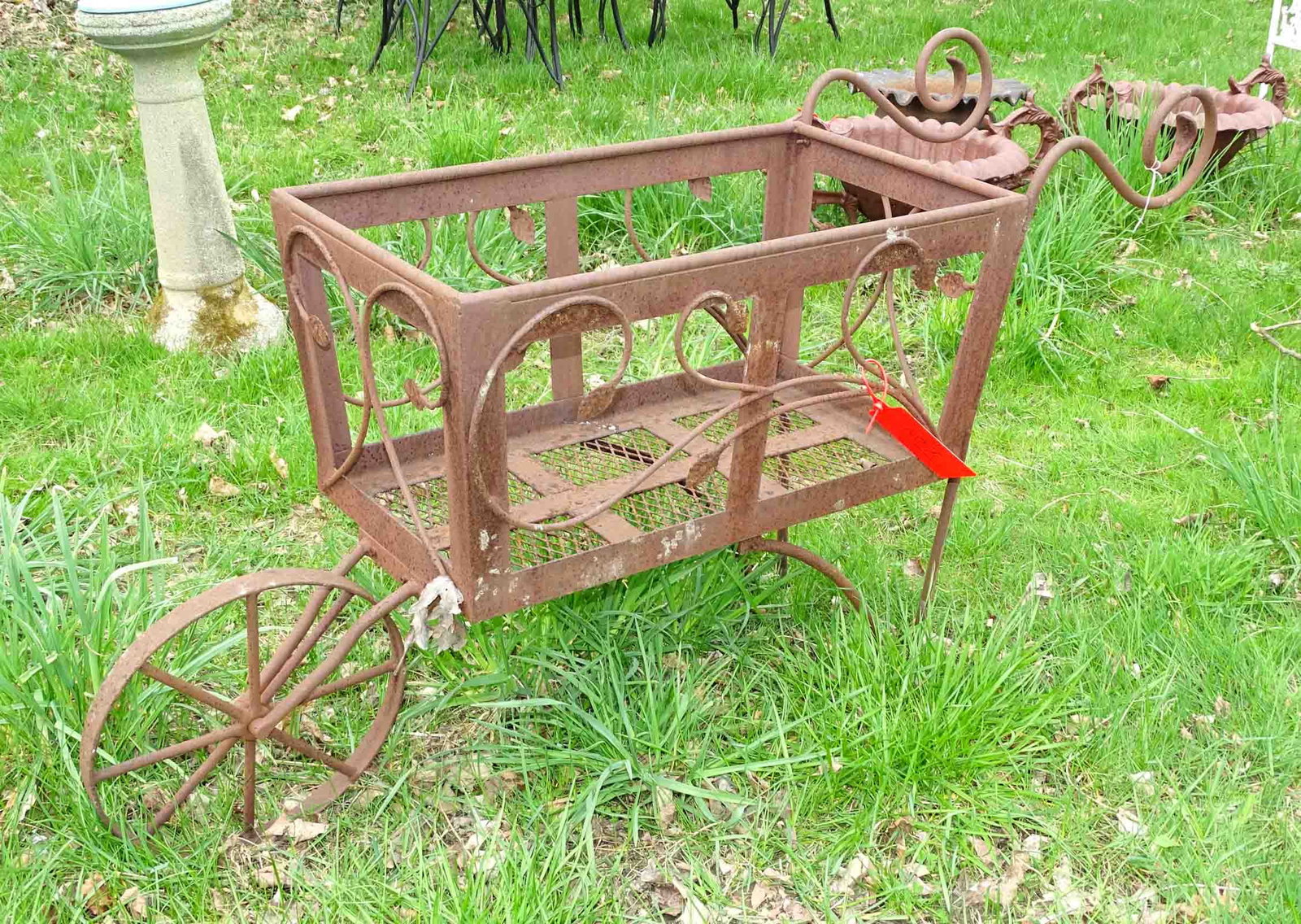 Metal Wheelbarrow Planter: Metal wheelbarrow planter.