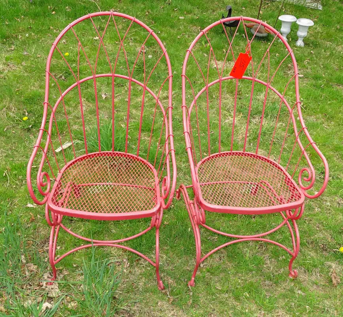 Pair of Iron Chairs: Pair of wrought iron arm chairs.