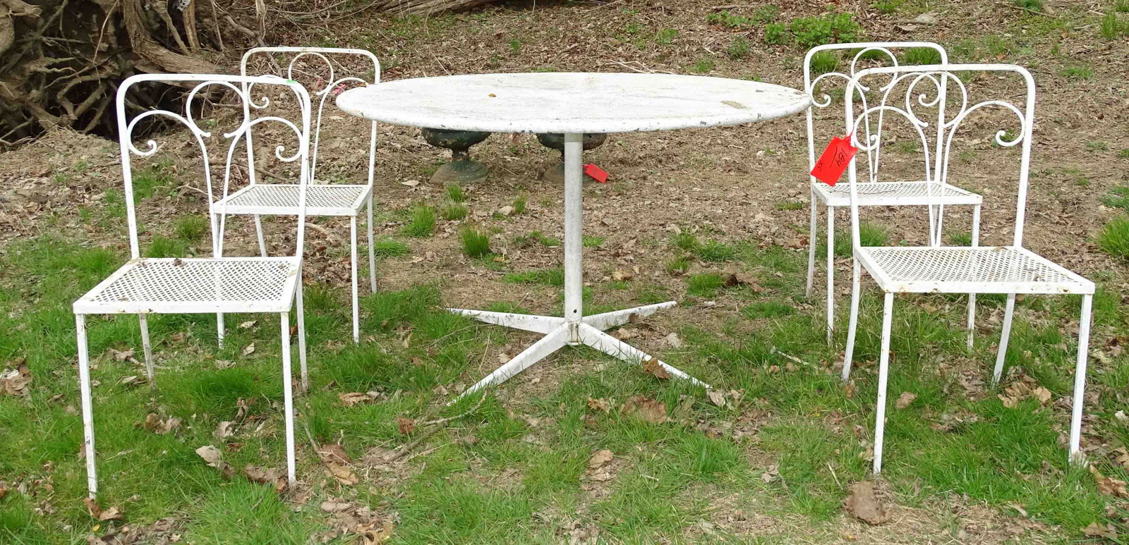 Wrought Iron Patio Set: Wrought iron patio set including: round table 48" Dia. x 30" Ht. and (4) side chairs.