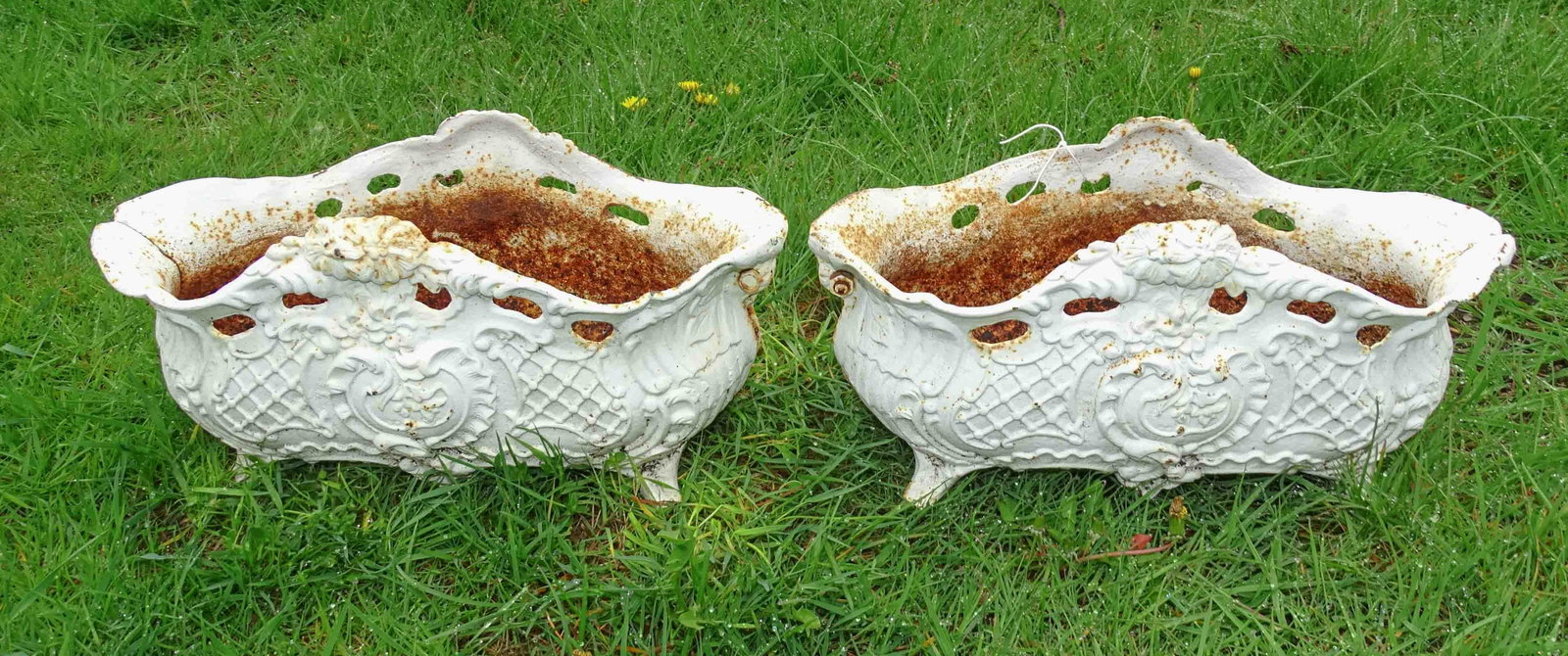 Pair of Cast Iron Planters: Pair of cast iron planters 16" L. x 8" Ht. x 8" W..
