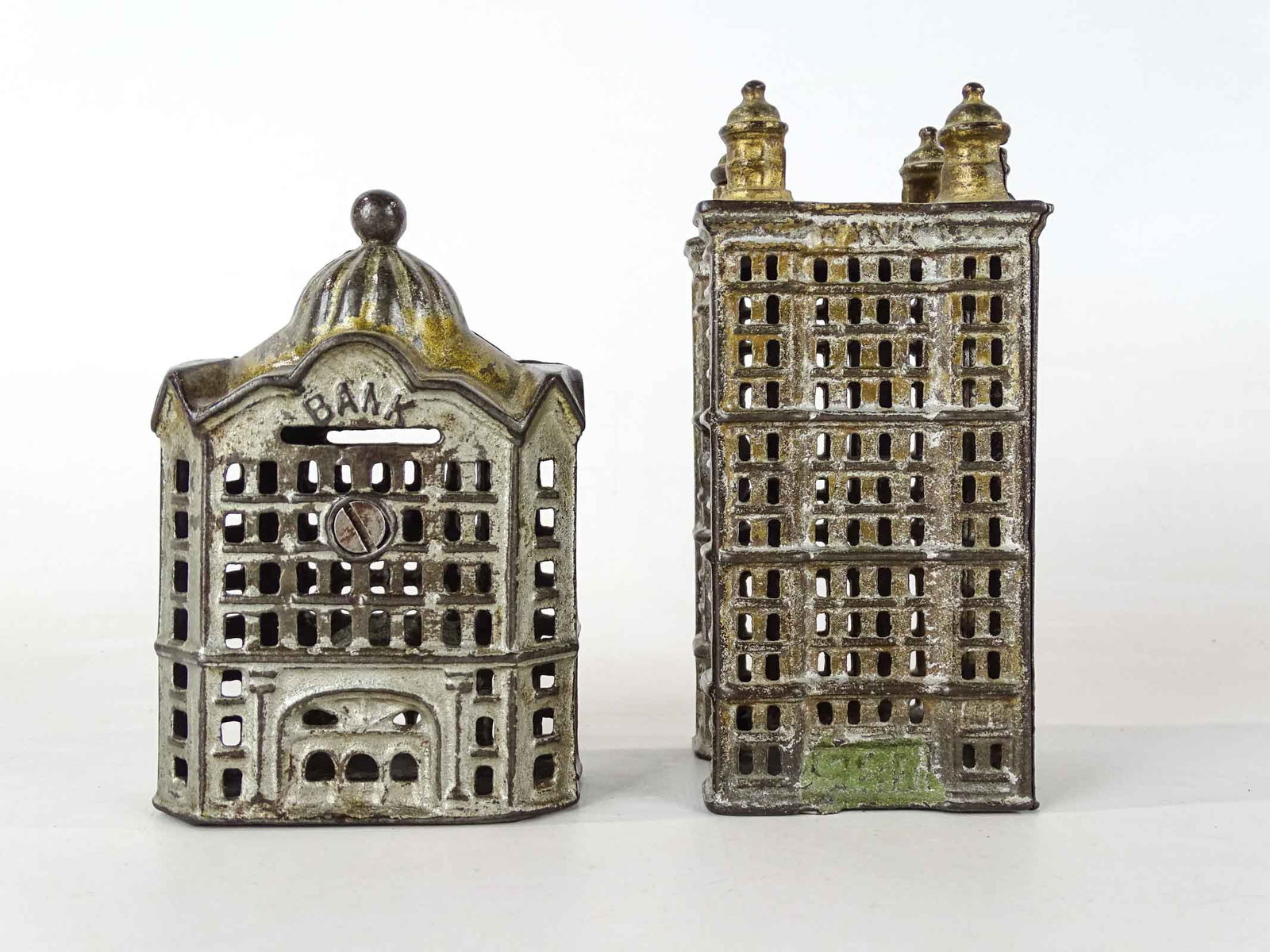 Building Banks: Lot (2) early cast iron building banks. 6" and 5" Ht.. One loose.