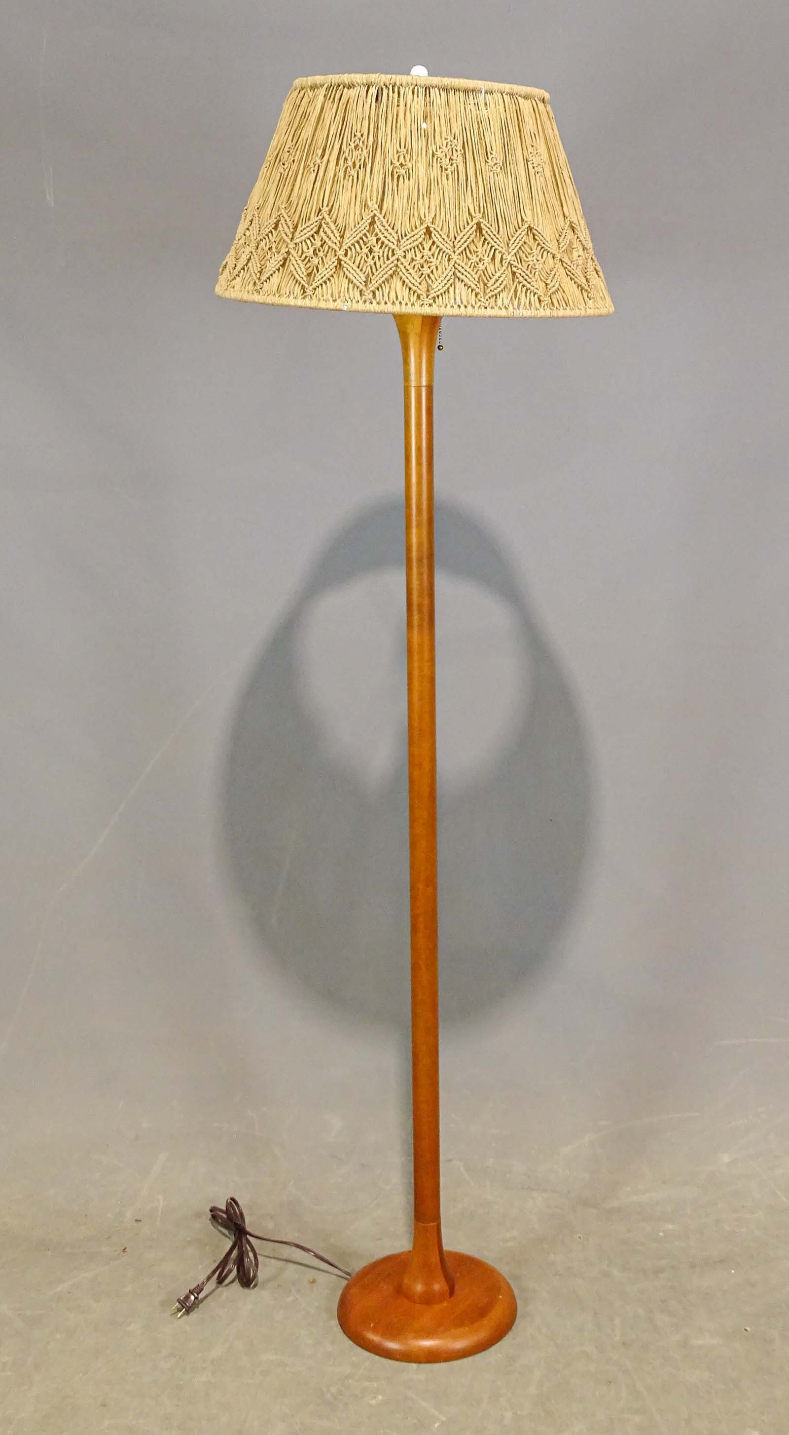 1970's Teak Floor Lamp: 1970's teak floor lamp with macrame shade. 67" Ht..