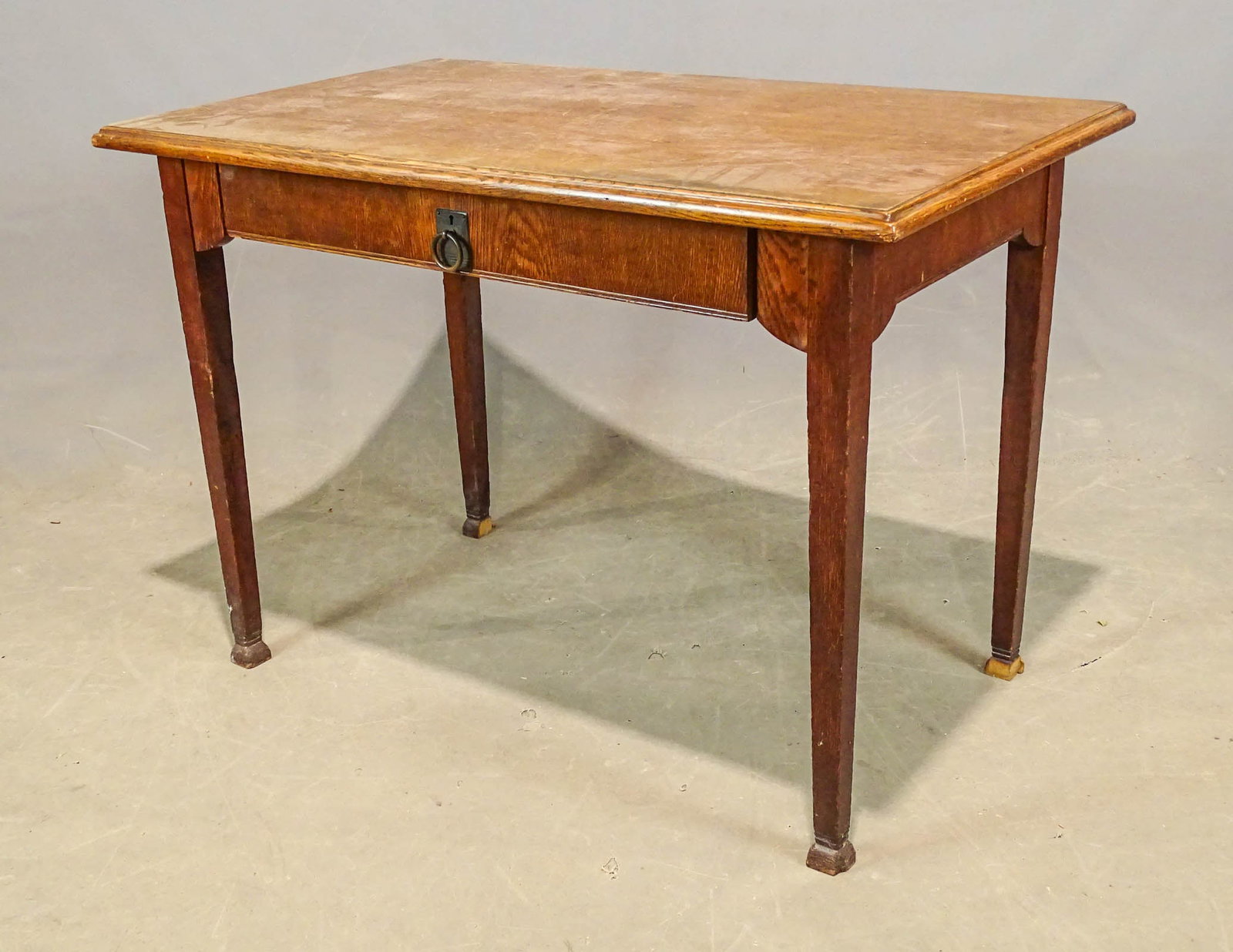 Mission Oak Desk: Mission oak single drawer desk. 43" x 26 1/2" x 31". Loss to feet.