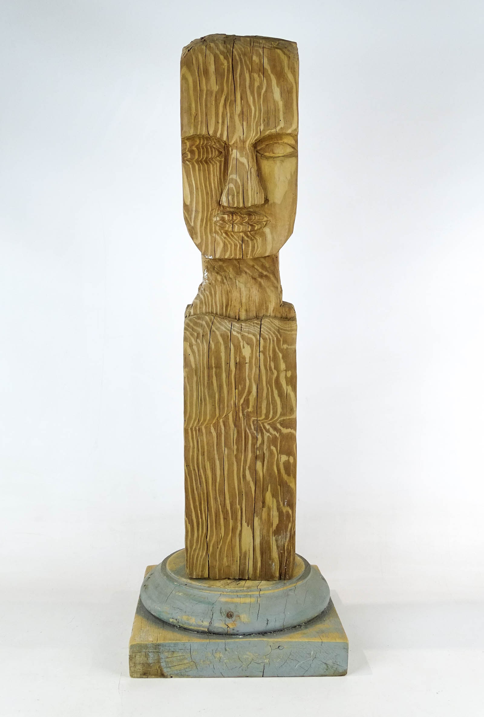 Folk Art Wooden Carved Head: Folk art carved wooden head. 25" Ht.. Comes with wooden base.