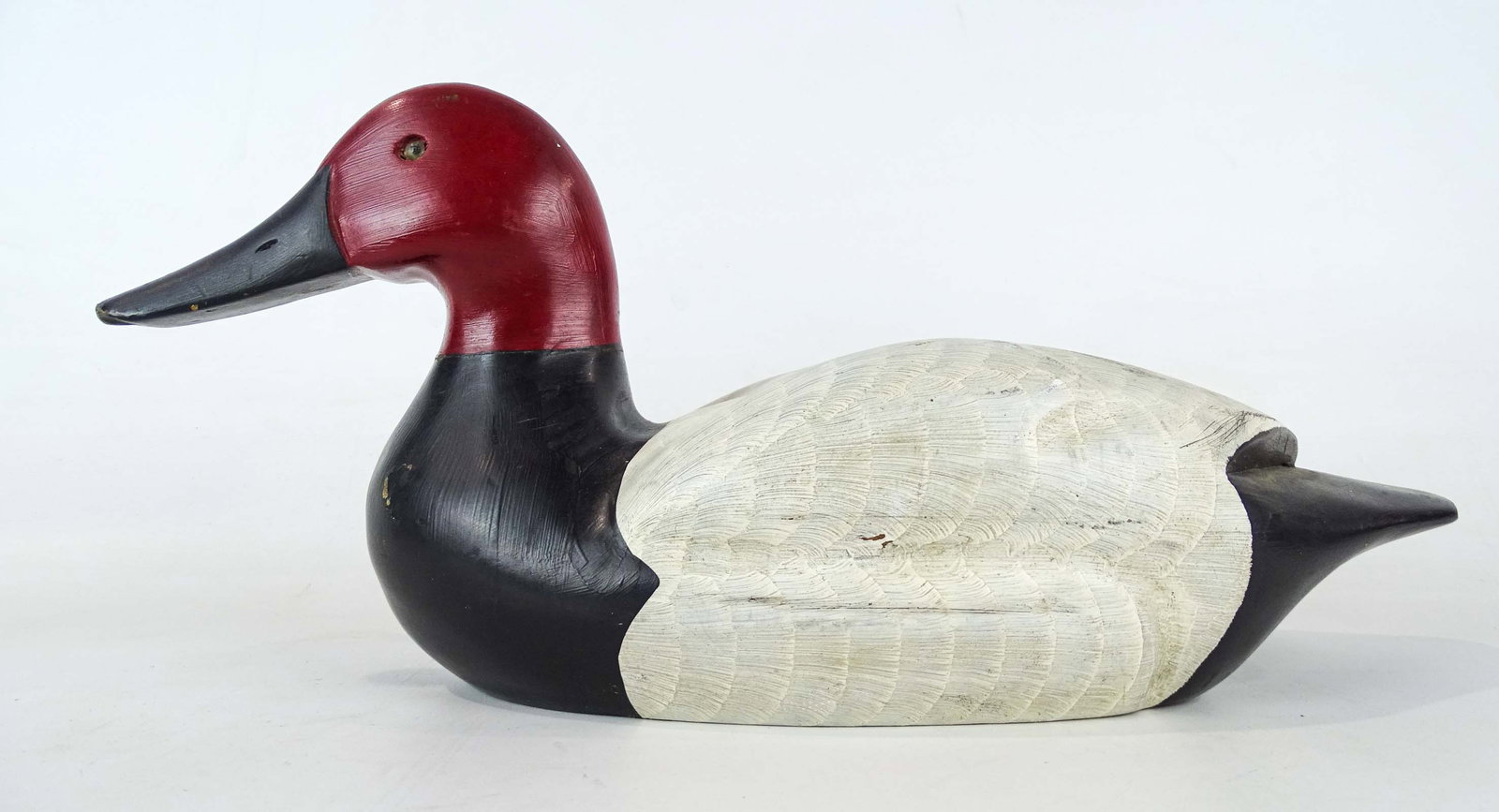 Decoy: Carved wooden decoy. 15" L..