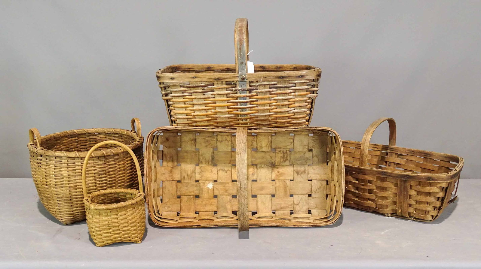 Basket Lot: Lot (5) early baskets. Largest 24" x 13" x 9 1/2".