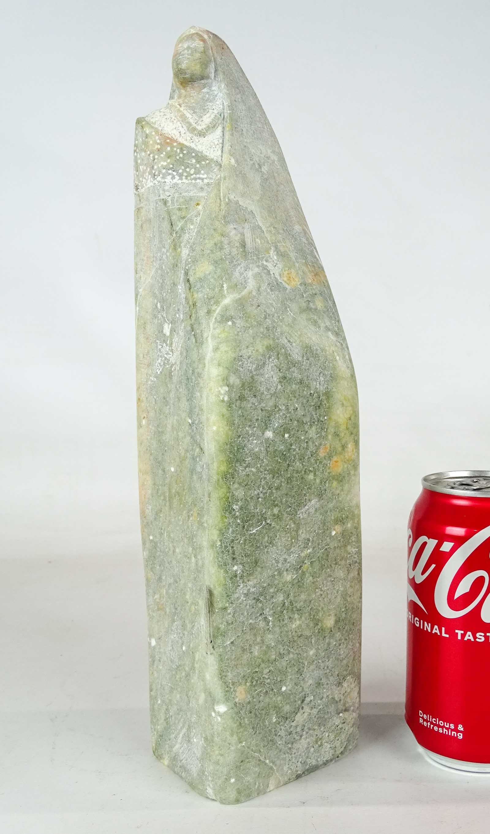 Stone Carving: Stone carving, stylized standing woman. 13 1/4" Ht..