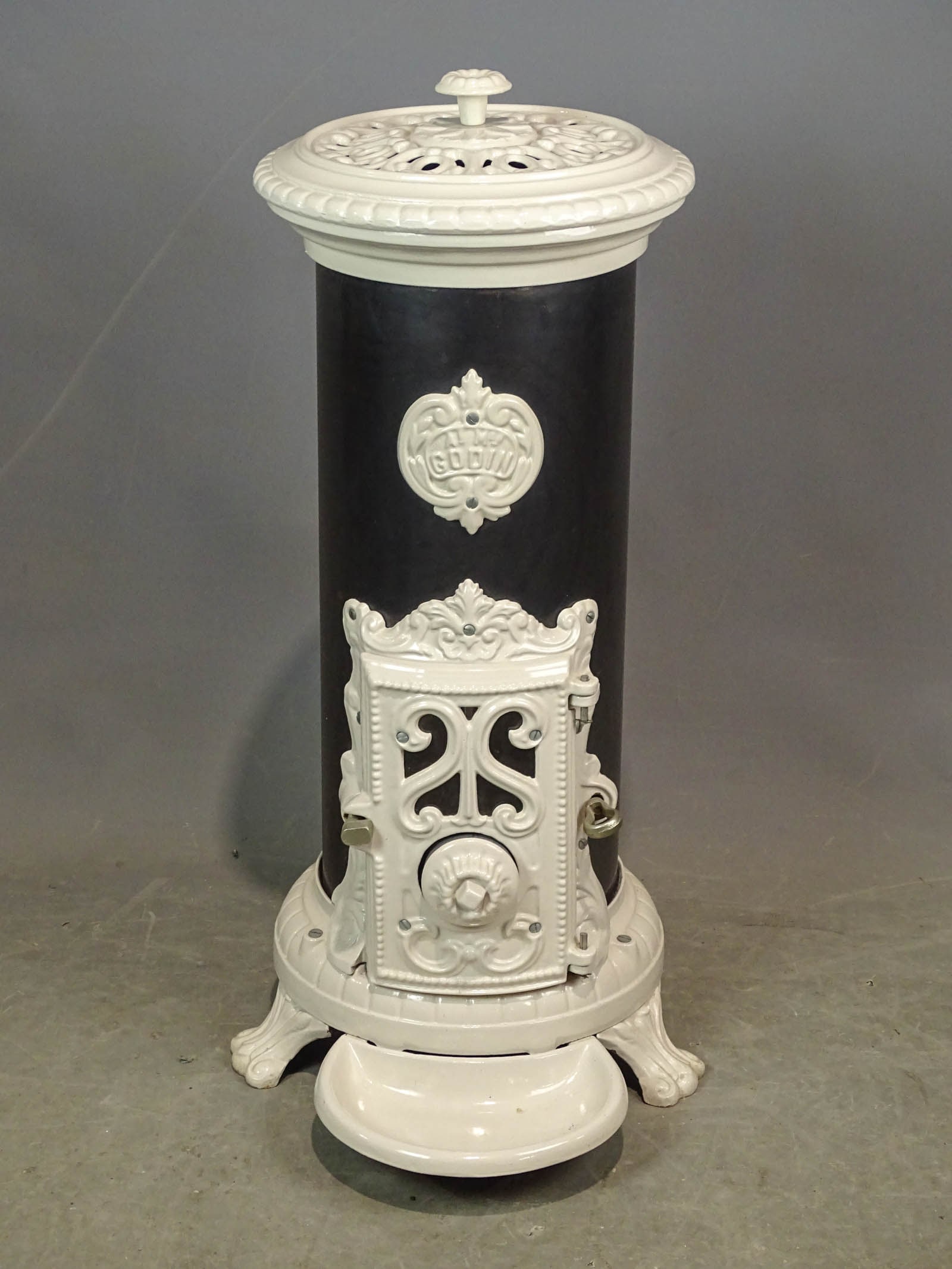 Enameled Stove: Early enameled stove. 32" Ht.. Marked "GODIN".