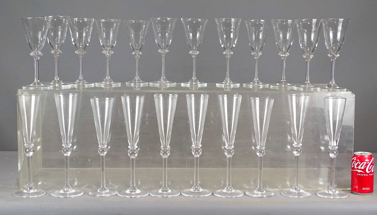 Simon Pearce Champagne Flutes and Wine Glasses: St of (10) Simon Pearce champagne flutes. 11 3/4" Ht., along with (12) wine glasses (9" Ht.).
