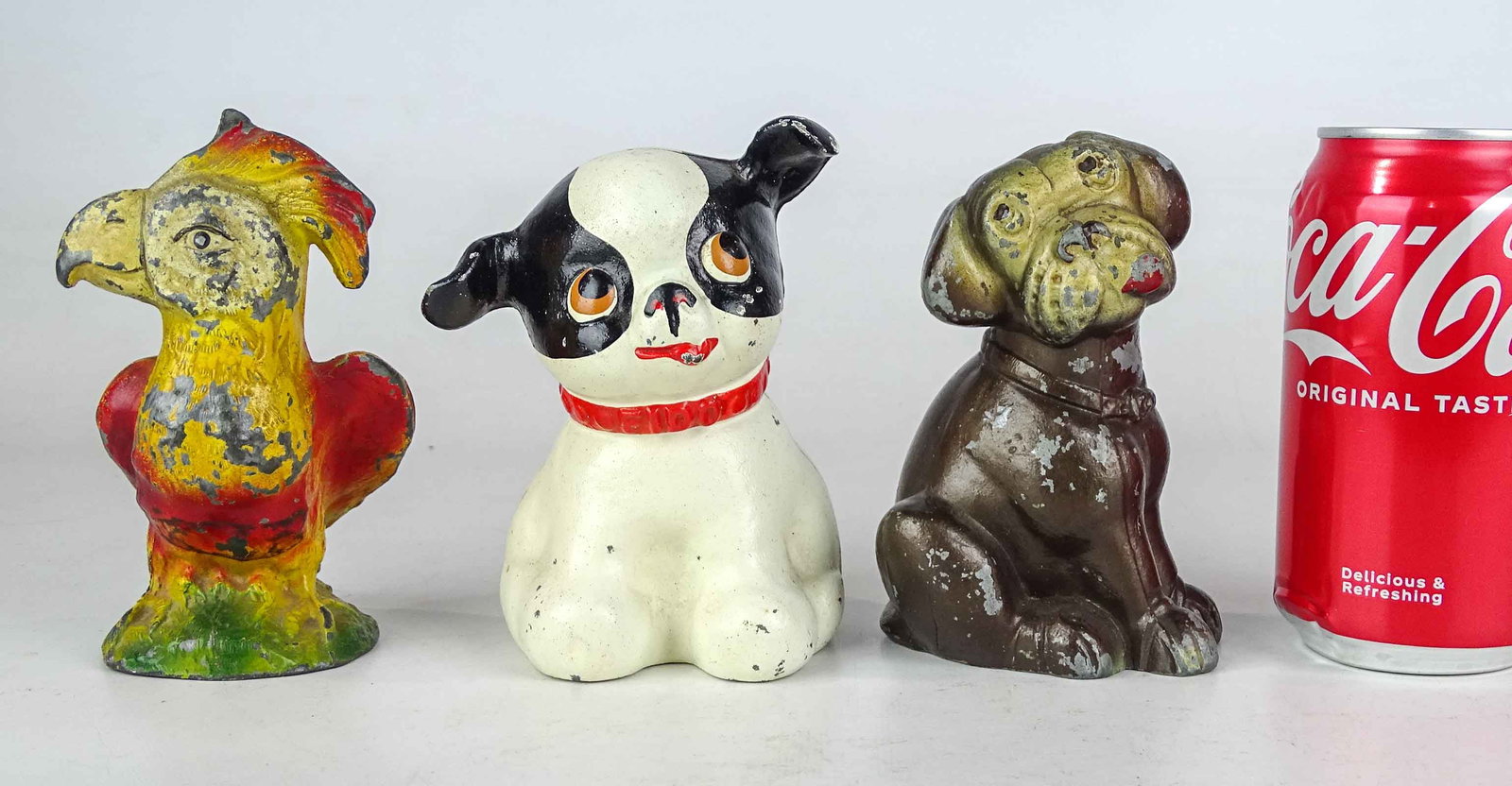 Bank Lot: Lot (3) banks including cast iron parrot (5" Ht.), Hubley dog (5" Ht.), dog (5" Ht.).