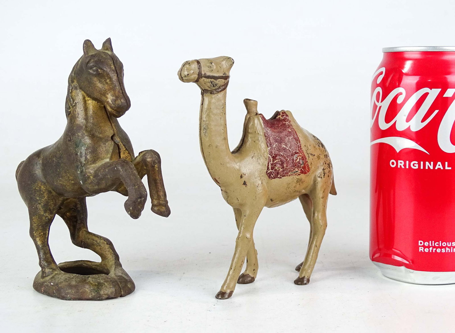 Bank Lot: Lot (2) 19th c. cast iron banks including camel (4 1/2" Ht.), and rearing horse (5 1/2" Ht.).