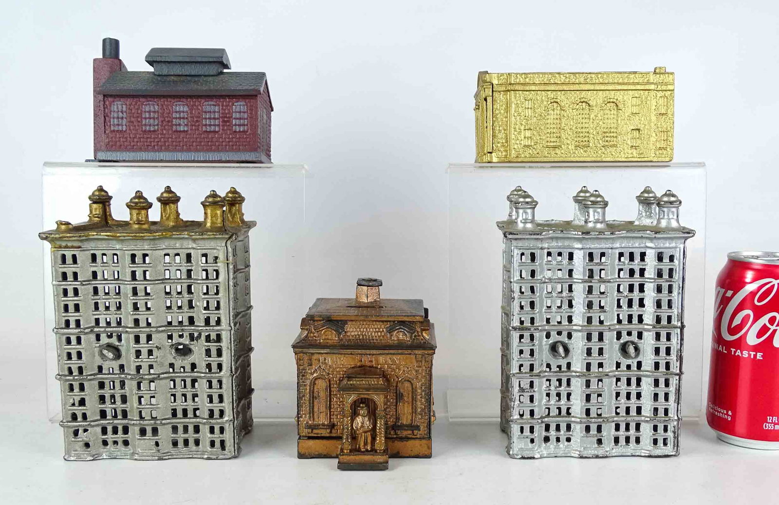 Bank Lot: Lot (5) cast iron building banks. Tallest 6 1/2" Ht.. One missing finial.