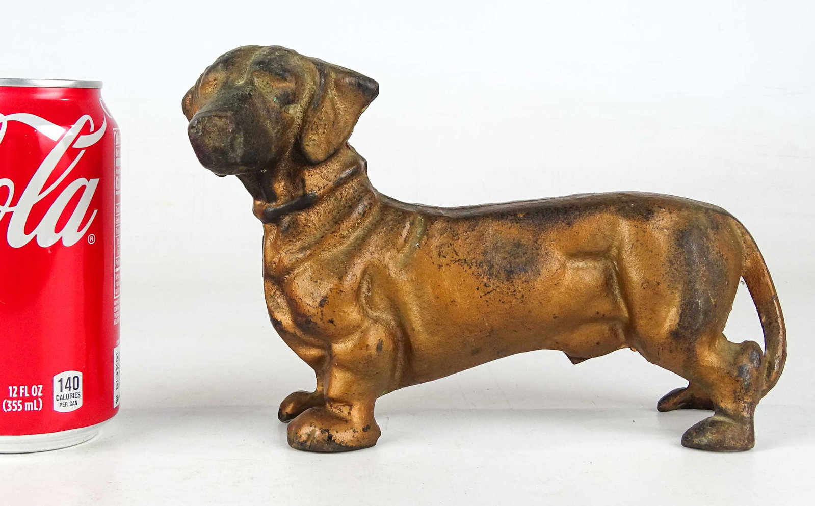 Daschund Bank: Cast iron Daschund bank. 5" Ht., 8 1/2" L..