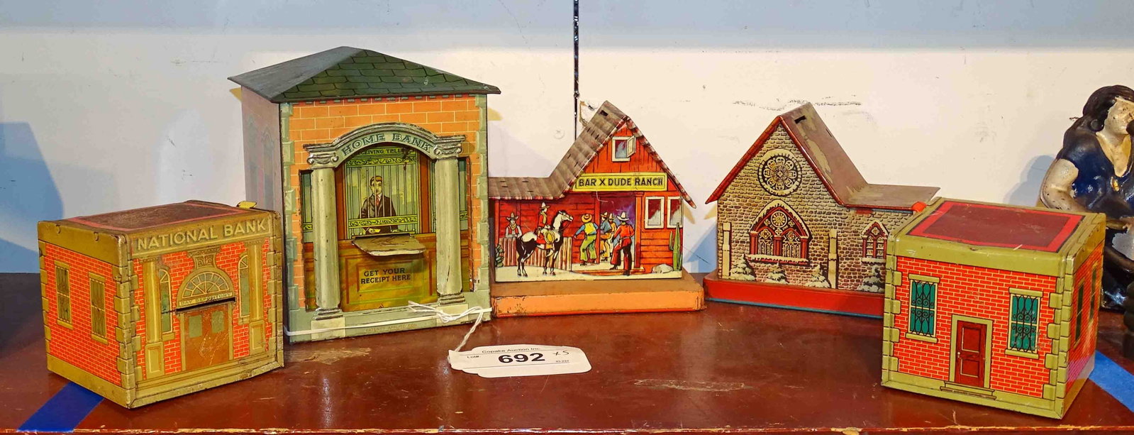 Bank Lot: Lot (5) tin litho building banks. Largest 5 1/2" Ht..