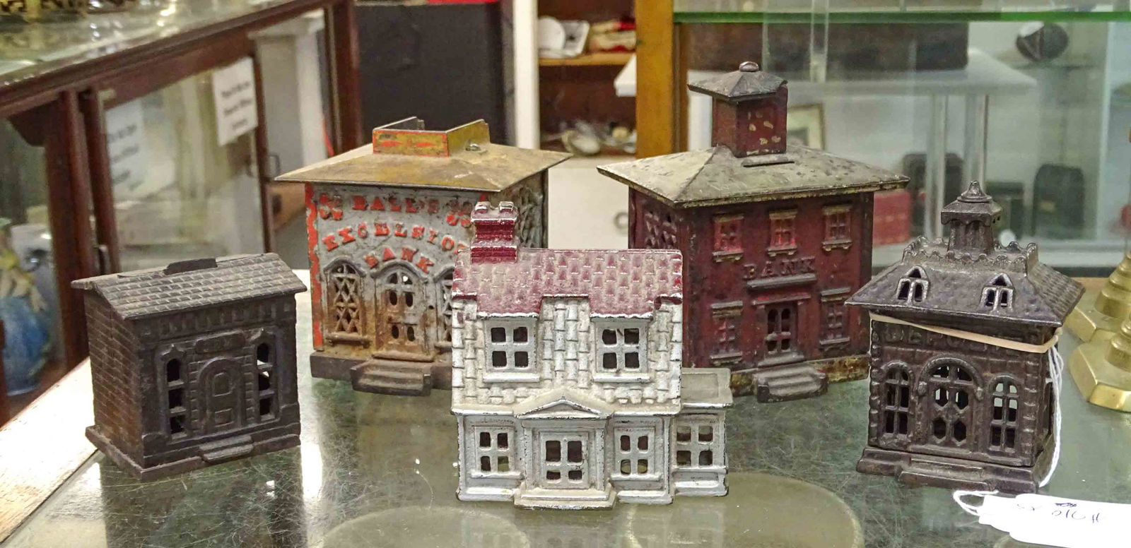 Bank Lot: Lot (5) 19th c. cast iron building banks. Tallest 5 1/2" Ht., (2) as found.